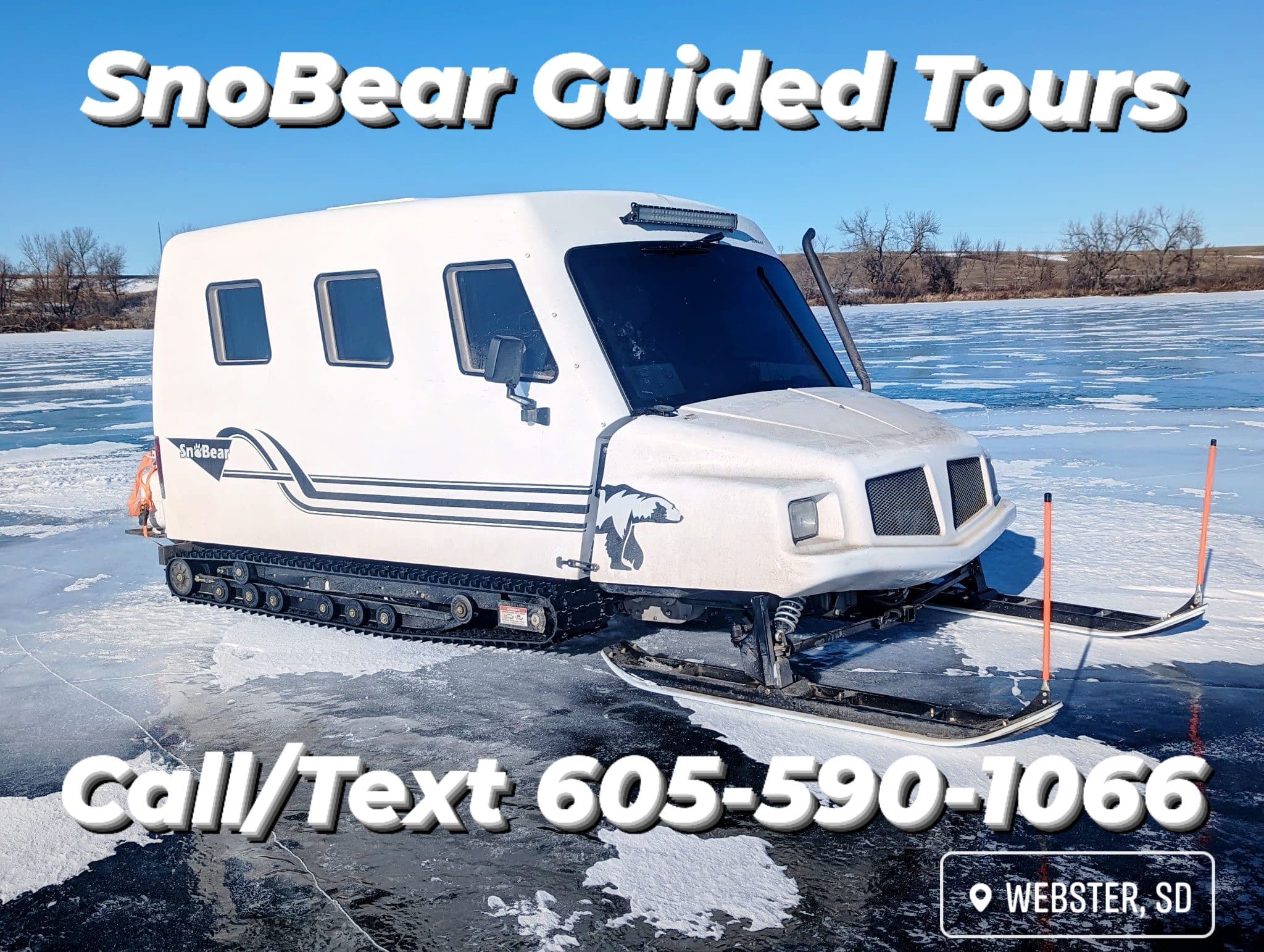 Group celebrating their catch beside a SnoBear in the snow